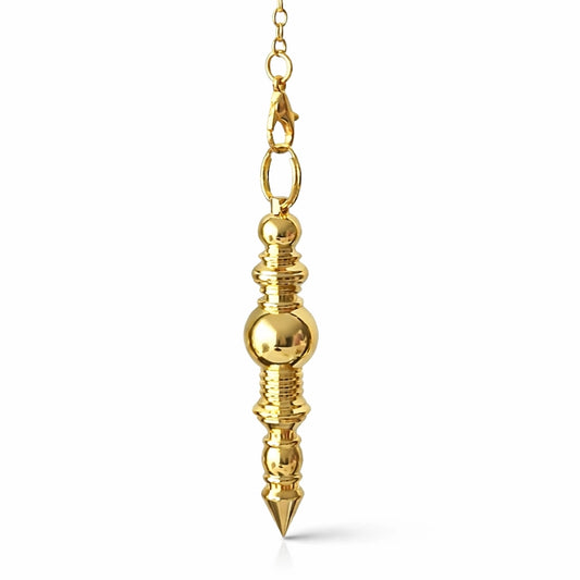 pendule baton en métal doré