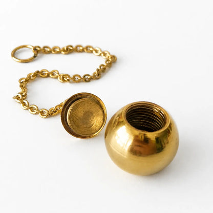 Pendule témoin sphère avec compartiment