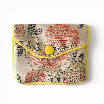 Pochette pendule en tissu brodé beige avec fermeture éclair